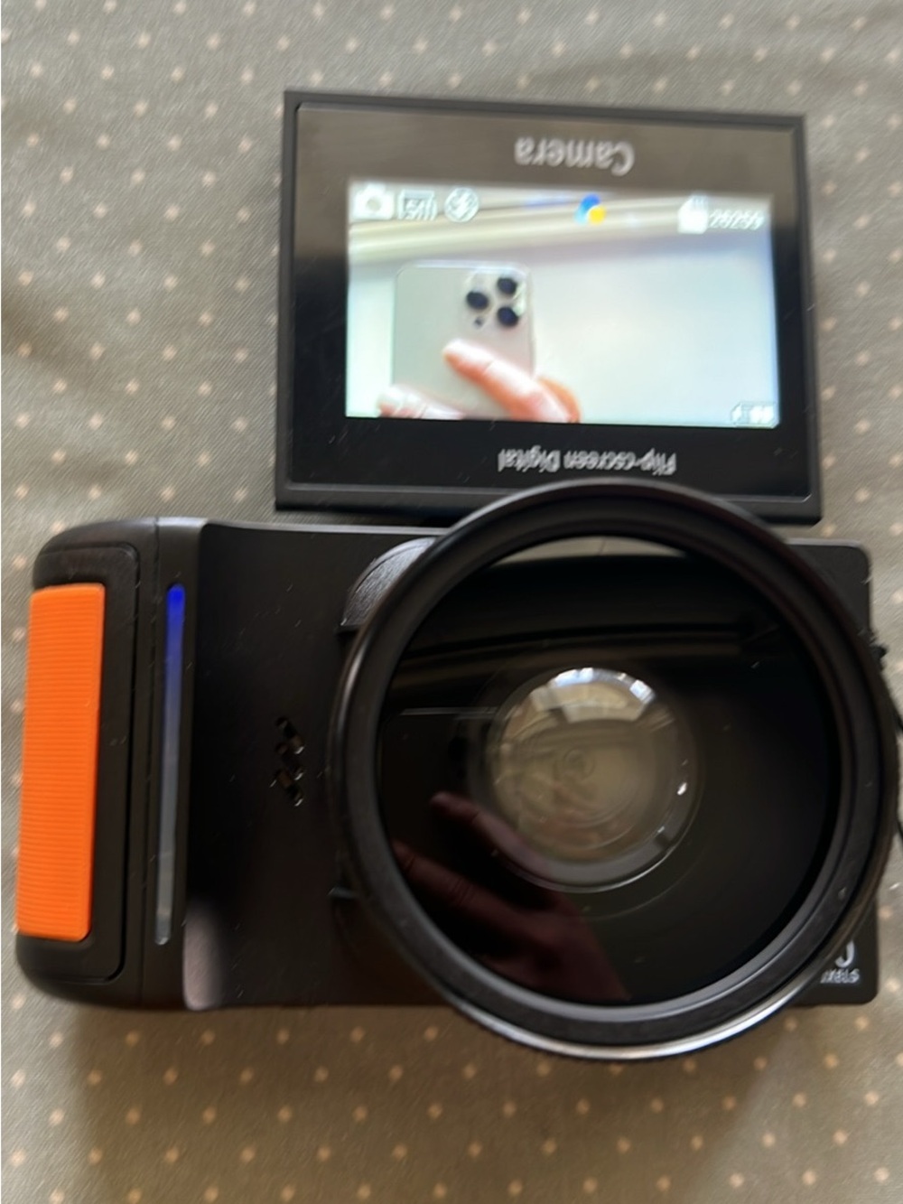 Compact Action Camera with Flip-Out LCD and Orange Accent